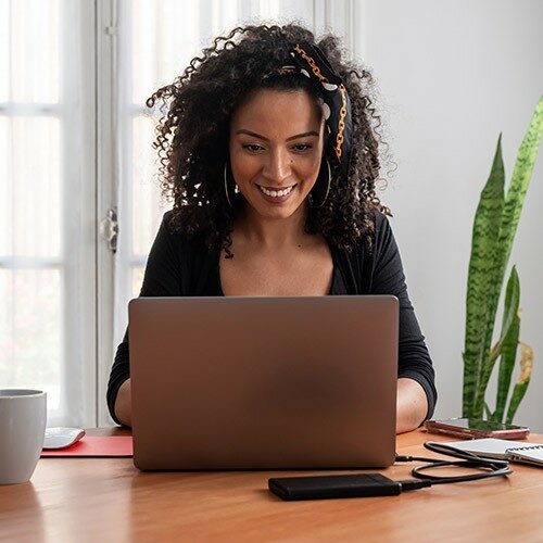 Woman working at home with laptop